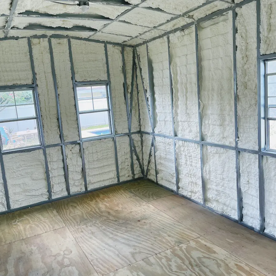 Closed-cell spray foam insulation applied to wall cavities in a residential project in Lake Charles
